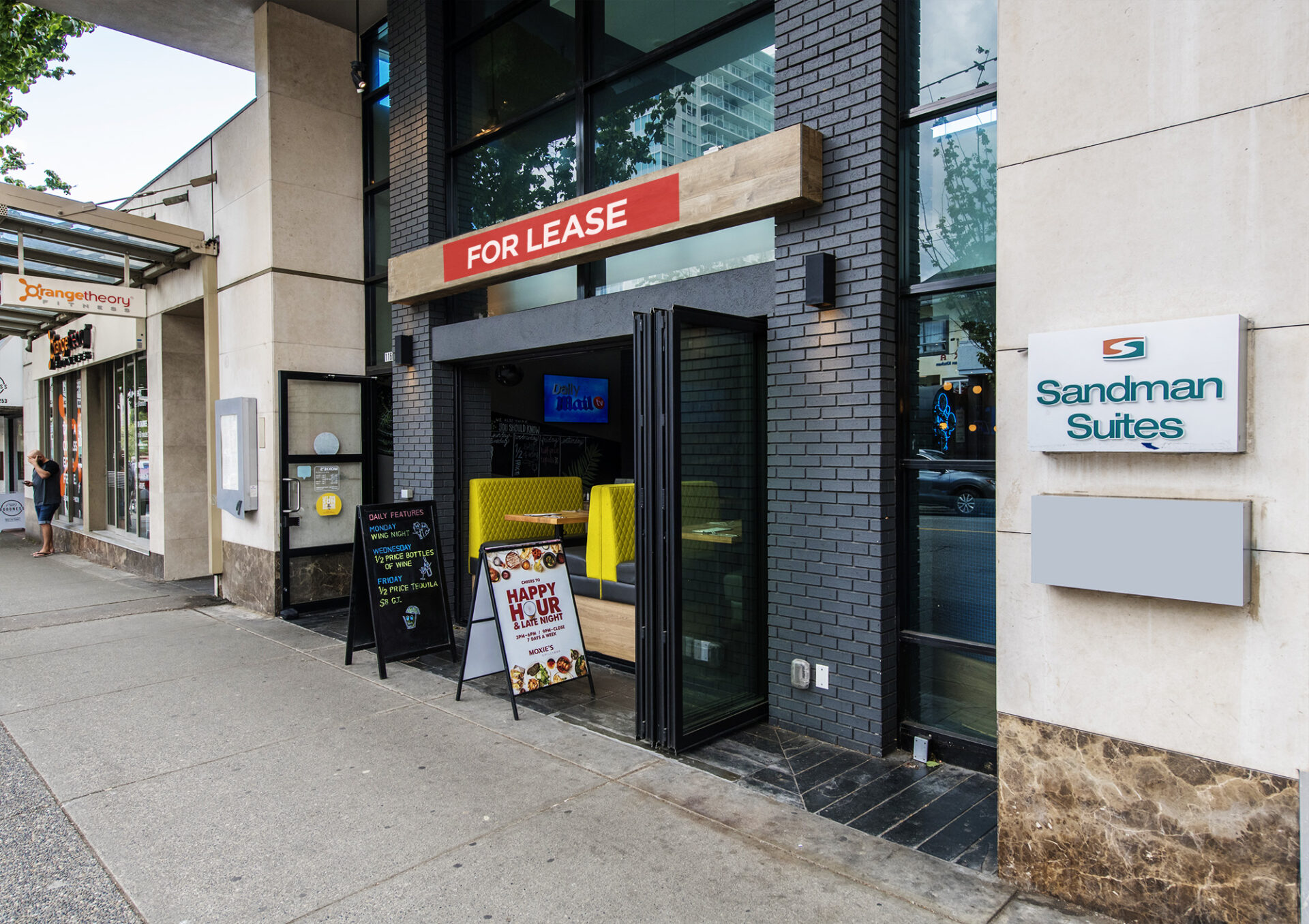 Entrance of 1160 Davie Street with a red Lease sign edited on top of the doorway